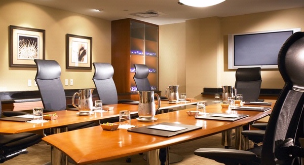 Boardroom table with settings.